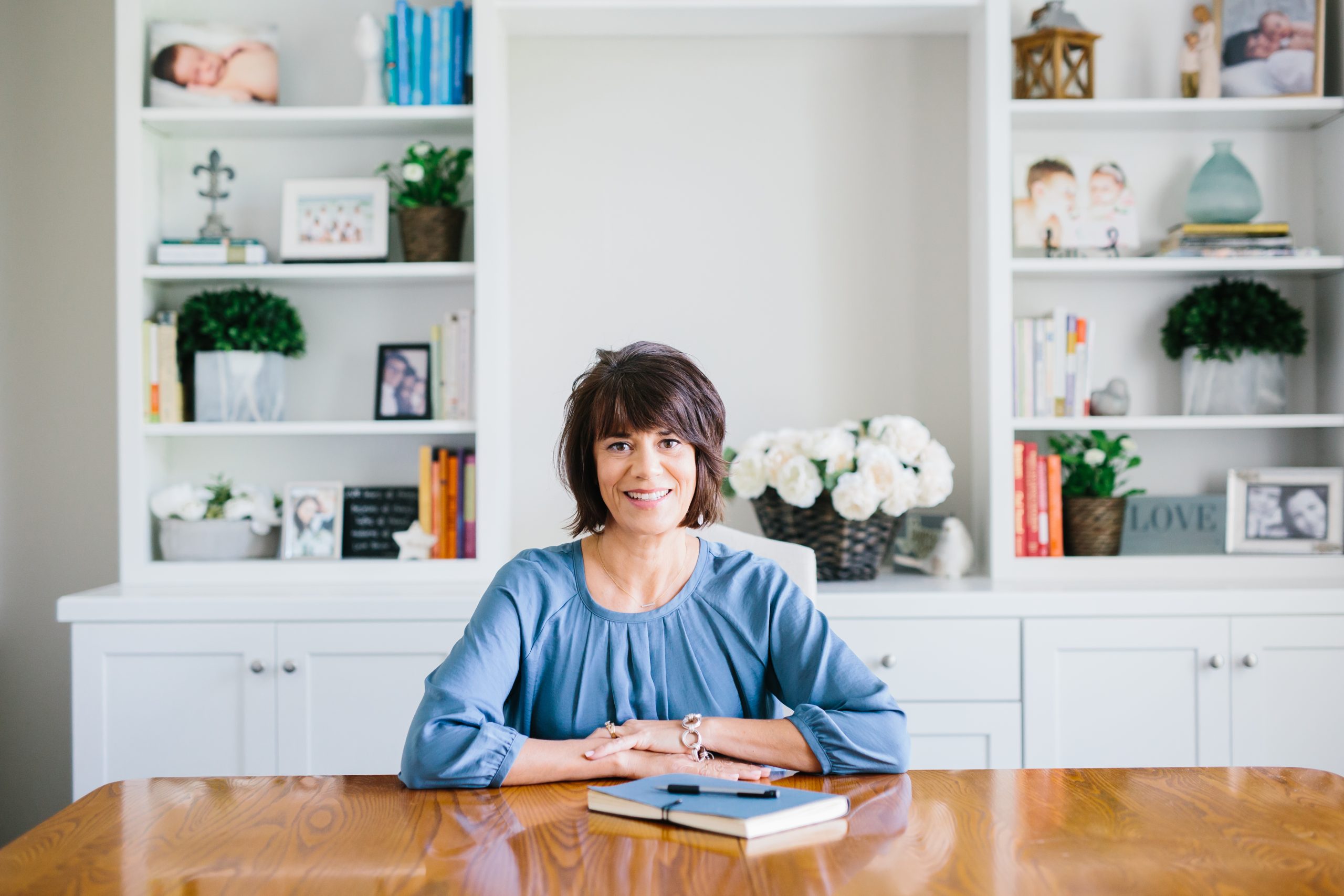 Leigh Germann at the table in her home office